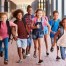 children running outside at school