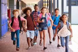 children running outside at school